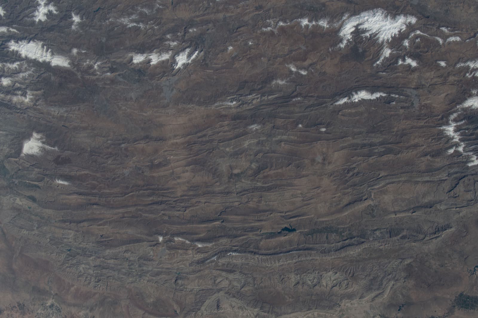 Aerial view of folded mountain ridges