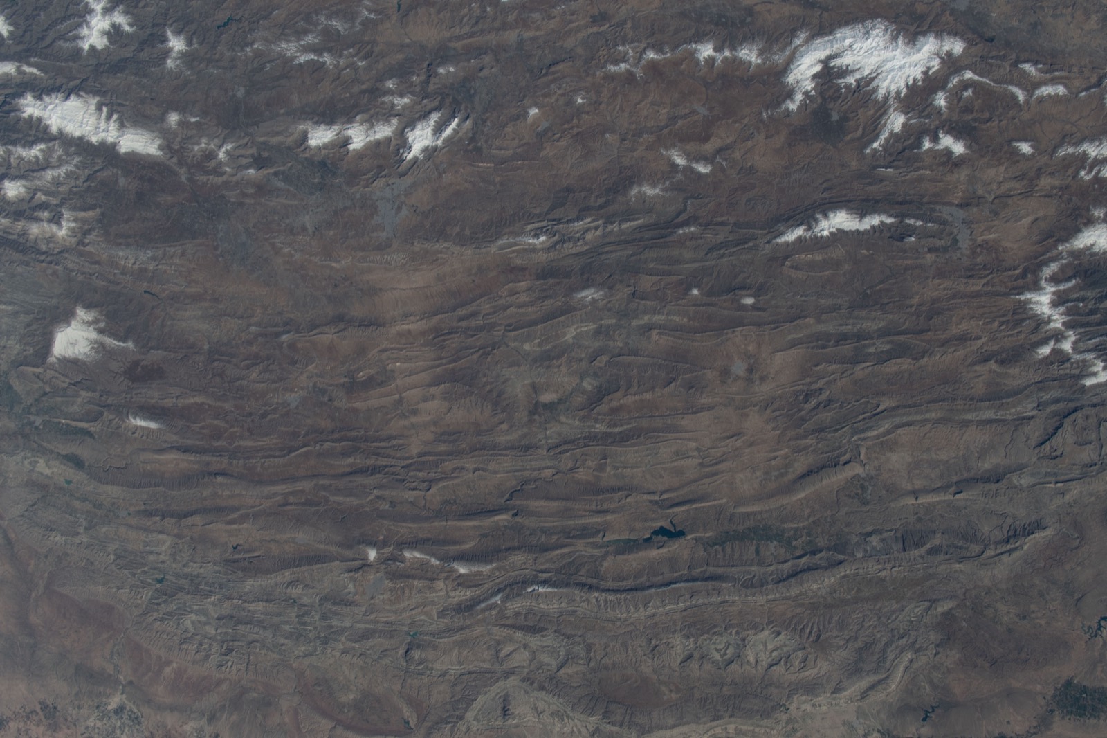 Aerial view of folded mountain ridges